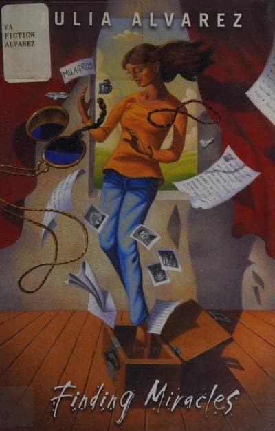 An illustrated jacket in dark maroon and grey-green: a girl in an orange top and jeans stands amid floating loose papers, photographs and a pocket watch on a chain, in front of an open window with a green landscape beyond; a small 'YA FICTION ALVAREZ' library spine-label sticker sits at the top left, and the title 'Finding Miracles' is lettered in white script at the bottom.