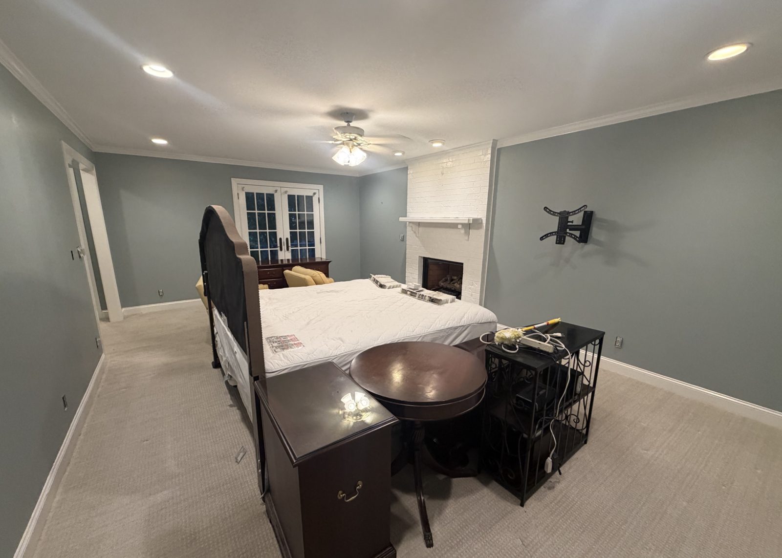 A bedroom, yellow walls to blue, after